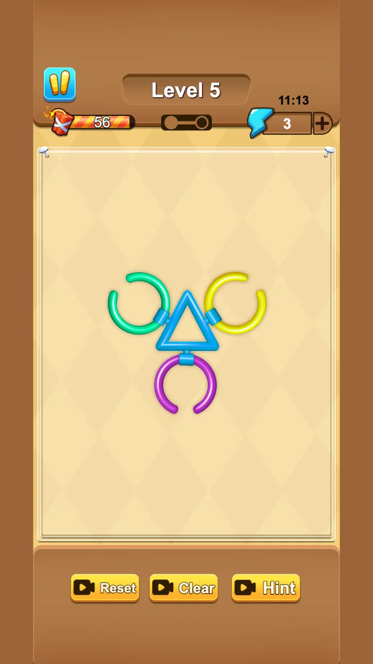 A blue triangle connected to green, yellow, and purple open rings in Level 5